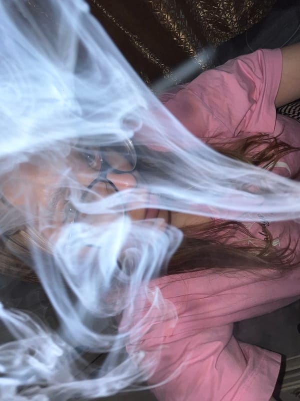 Woman takes selfies with ring light in Russian bedroom