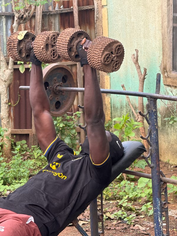 Outdoor strength training with homemade weights in Akwanga, Nigeria