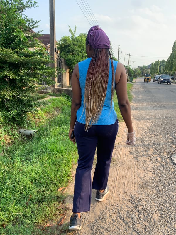 Morning street life along a residential road in Abuja