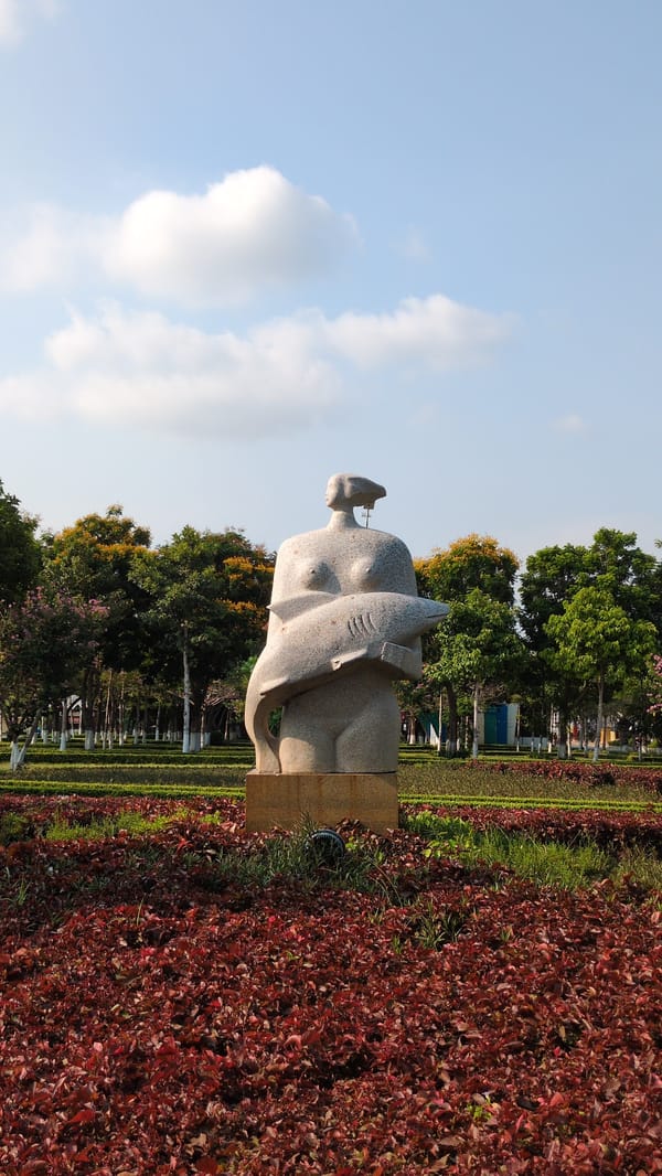 Man resting, monument viewed in Phan Rang Vietnam morning