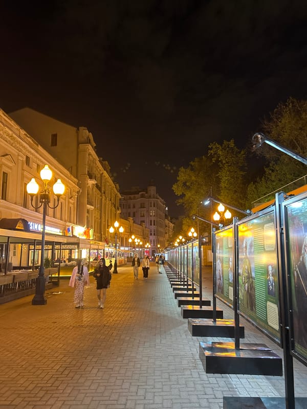 Nighttime street scene observed in unidentified city