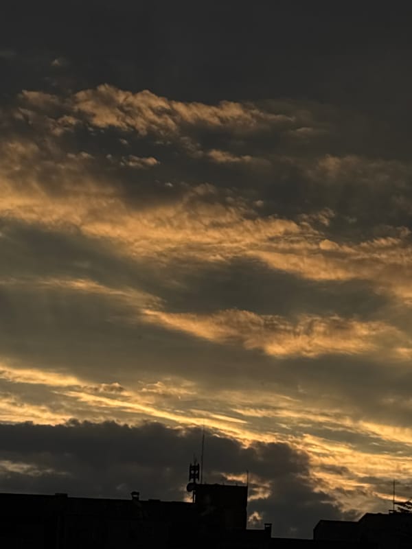 Golden sunset clouds shot from multiple angles in an urban setting.
