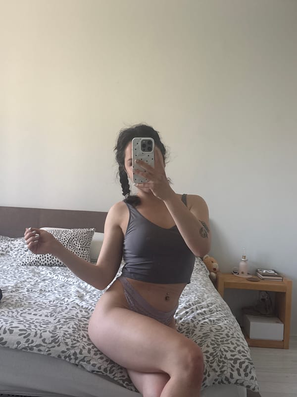 Woman takes bedroom selfie in Burgas, Bulgaria