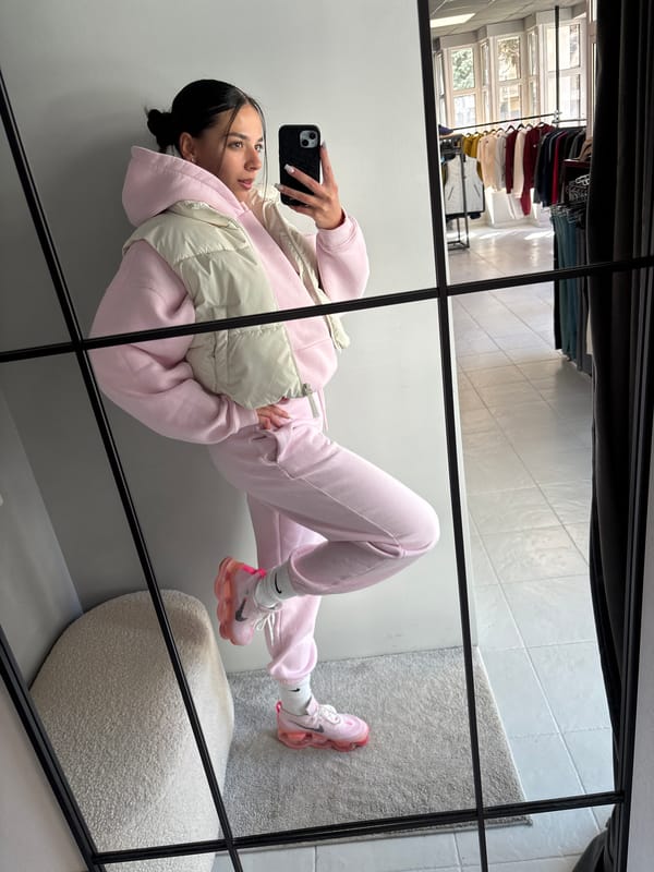 Woman takes mirror selfies, enjoys cupcake in Gabrovo morning