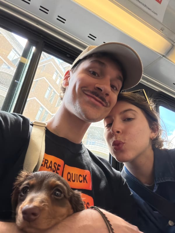 Couple and dog ride Montreal public transit together