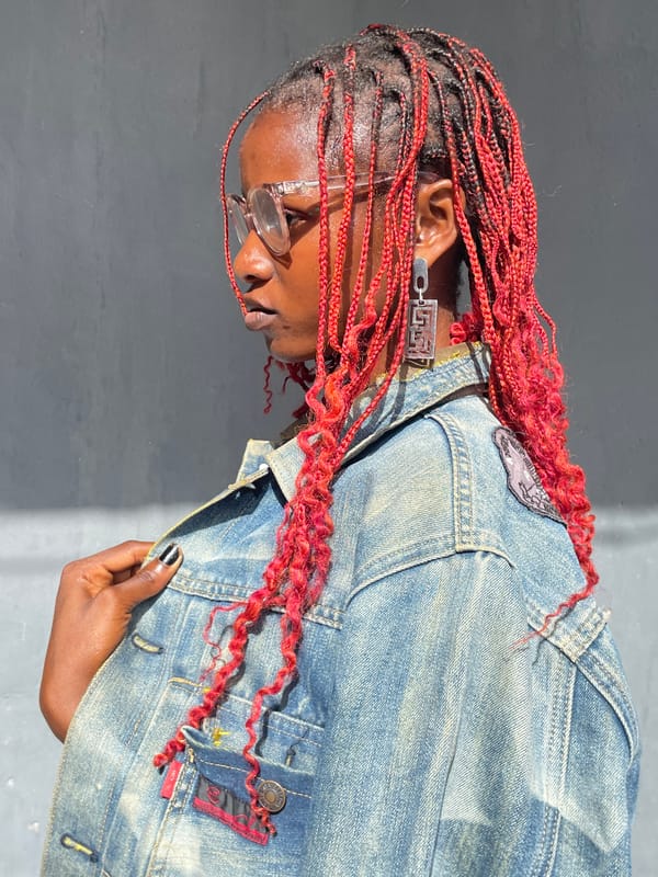 Portrait session documented in Badagry featuring woman with red braids