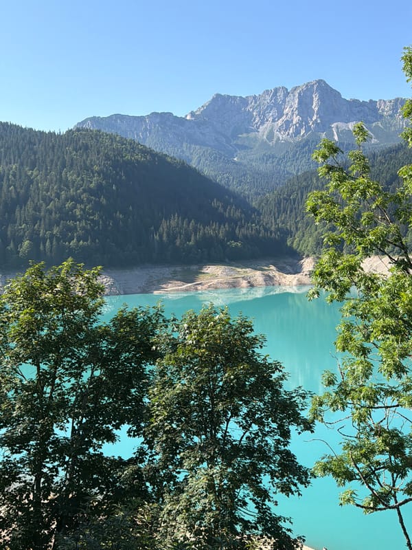 Morning at a turquoise alpine lake in the Carnic Alps