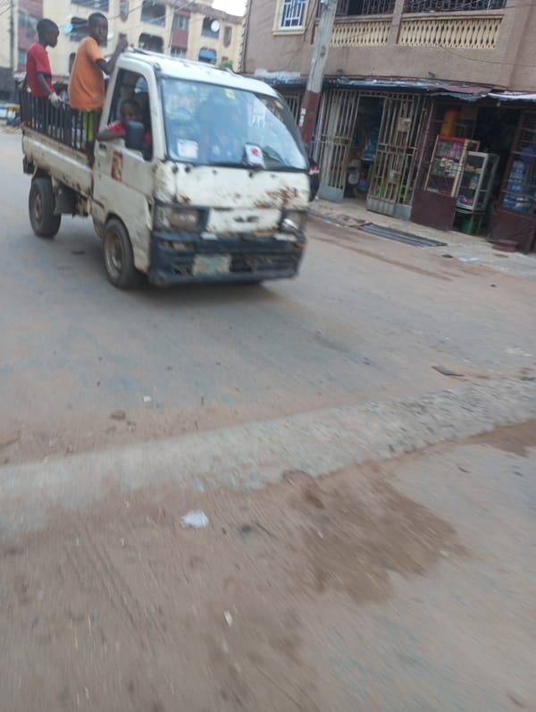 Ordinary street life documented across Onitsha, Nigeria during evening hours