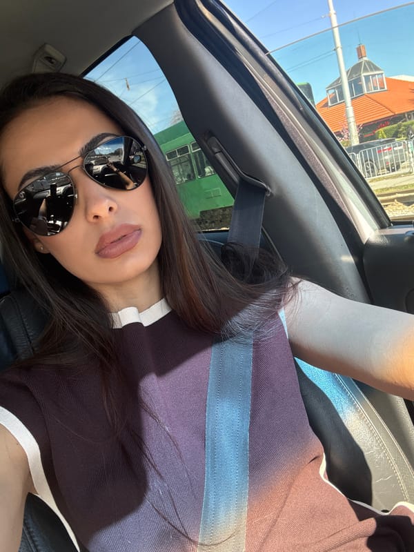 Woman in sunglasses observed in car in Sofia