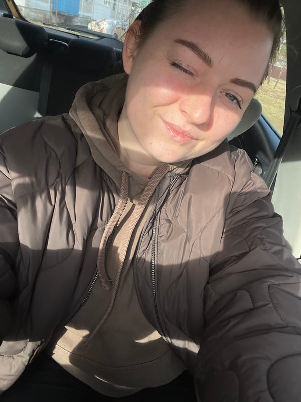 Woman photographed smiling in car interior in Раздолье, Russia