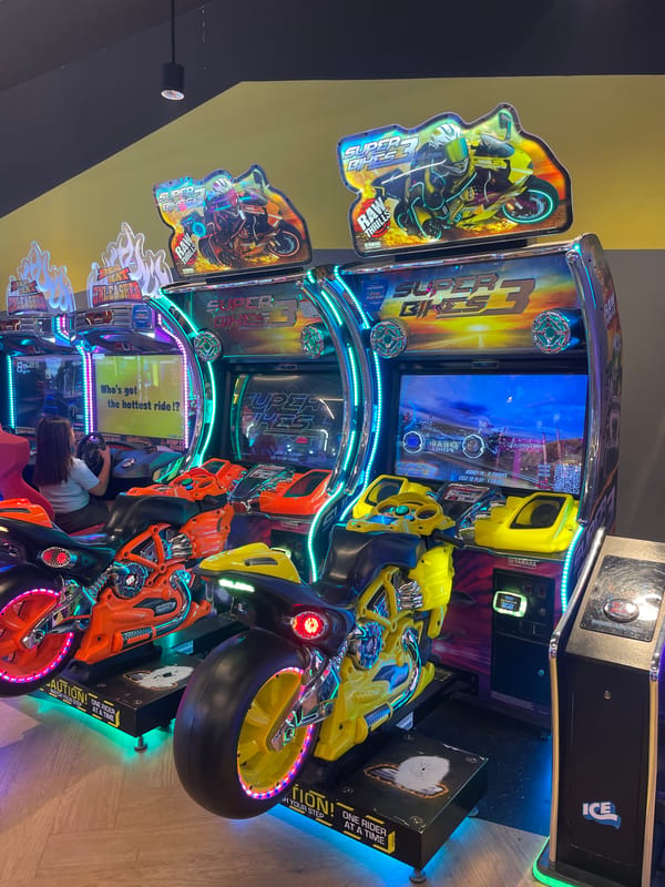 Morning at a Manado arcade, toy store, and coastal drive