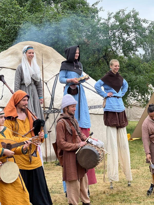 Medieval reenactment festival with stilt performers in Moscow park
