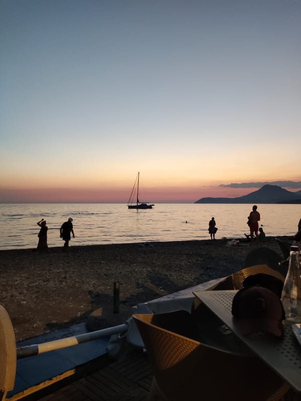 Dusk settles over Bar's beach with a soft mountain backdrop