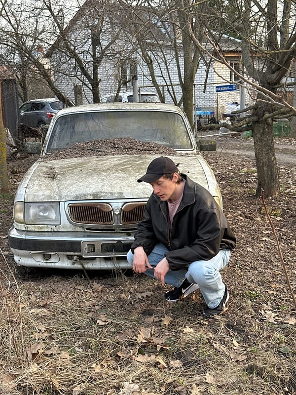 Young man spotted on vintage car hood in Kursk