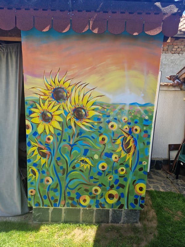 Sunflower oil painting spotted leaning against outdoor structure