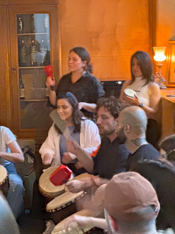 Group drumming session held in residential space in Yerevan