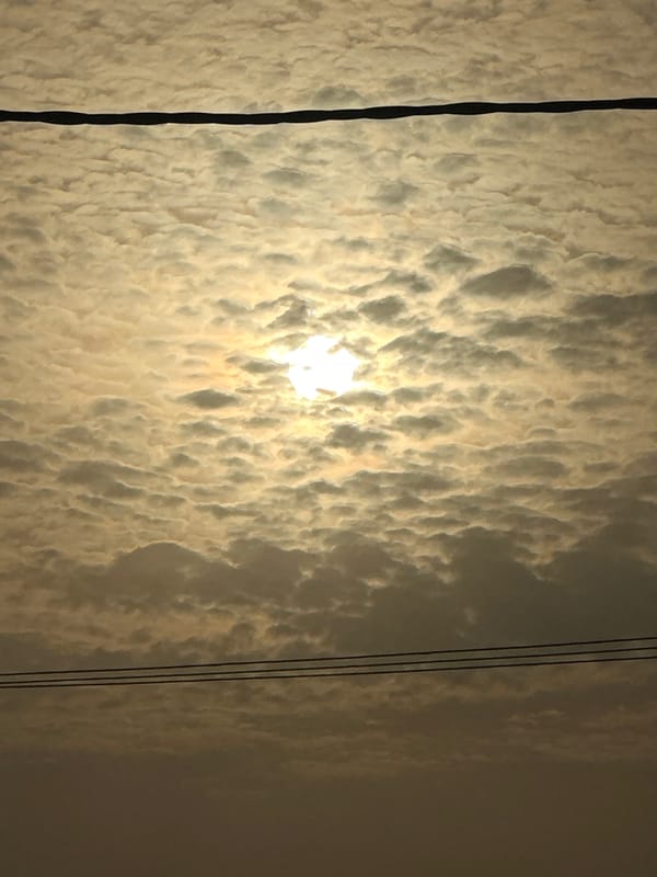 Dawn breaks through clouds over Bukuru power infrastructure