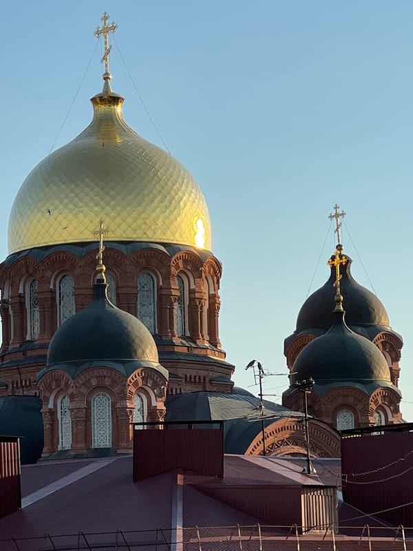 Krasnodar city streets and Orthodox cathedral on a sunny afternoon