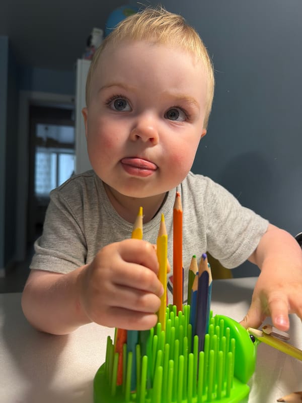 Child plays with colored pencils in Votkinsk, Russia