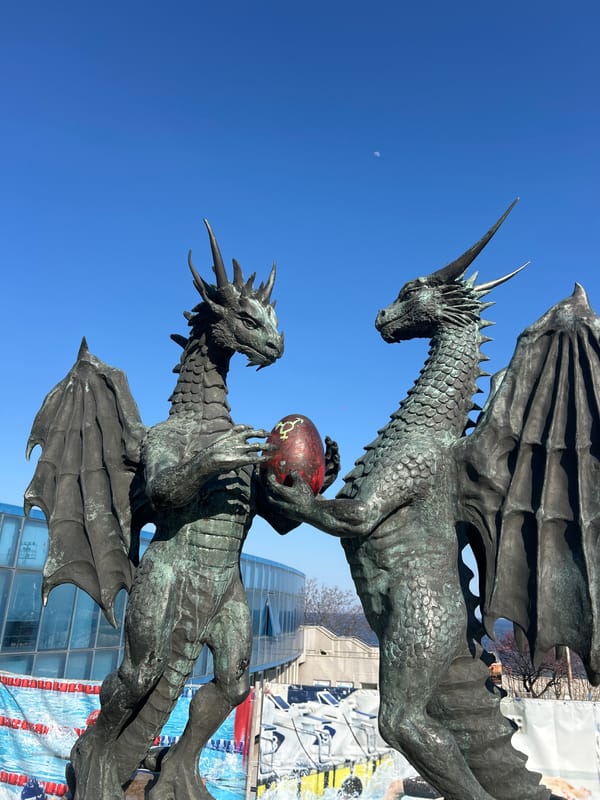 Bronze dragon sculpture with red globe observed in Varna