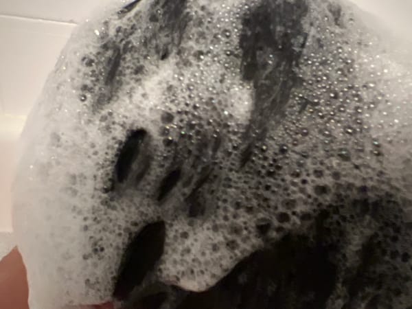 Bath time at home, with a few everyday objects nearby