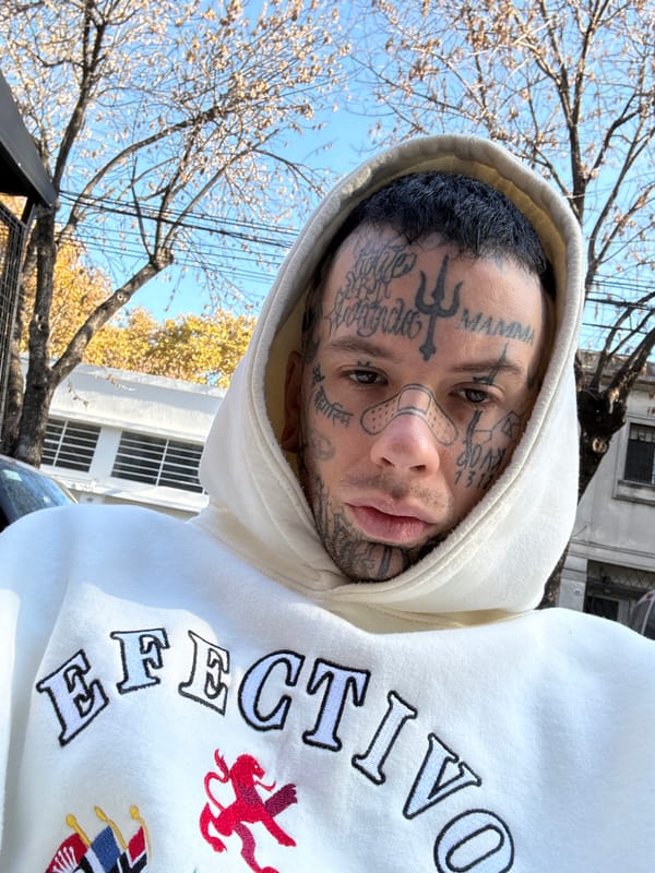 Tattooed individual photographed near Buenos Aires café