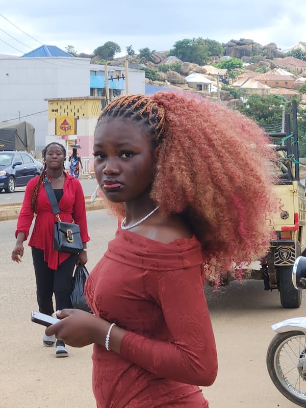 Street scene on a paved road in Kabong, Nigeria