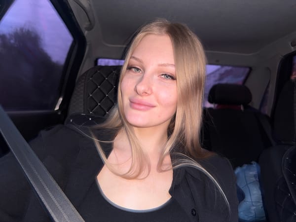 Woman takes selfies inside car in Perm, Russia