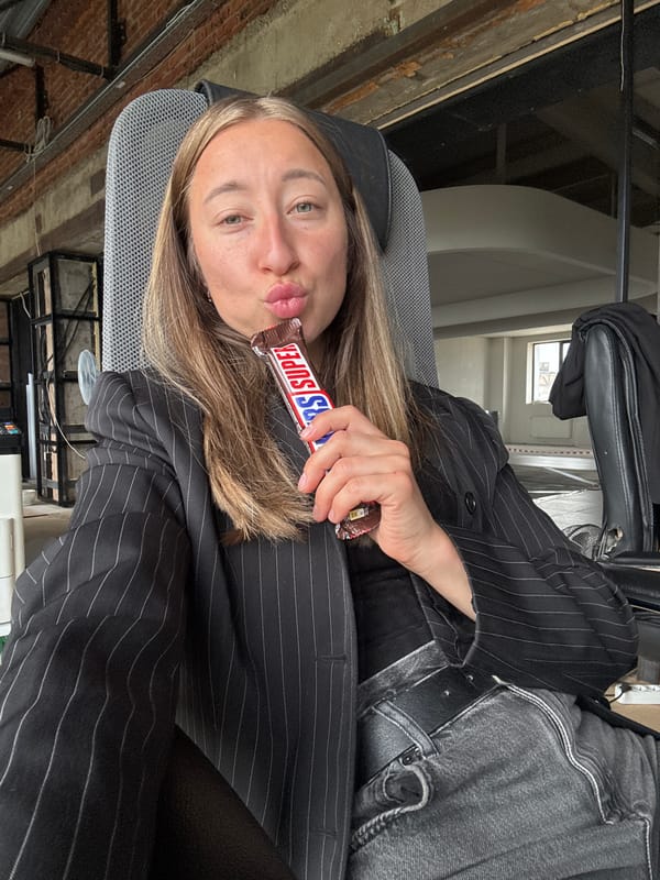 Woman takes selfies at Chaikovsky cafe during early morning
