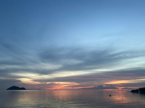 Koh Phangan beach at golden hour, sea and shore