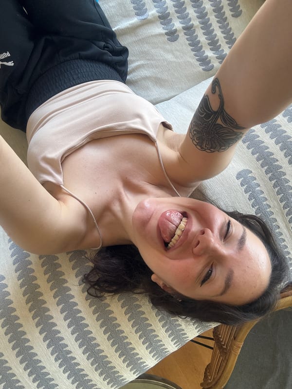 Woman poses playfully on cushion in Bulgarian town
