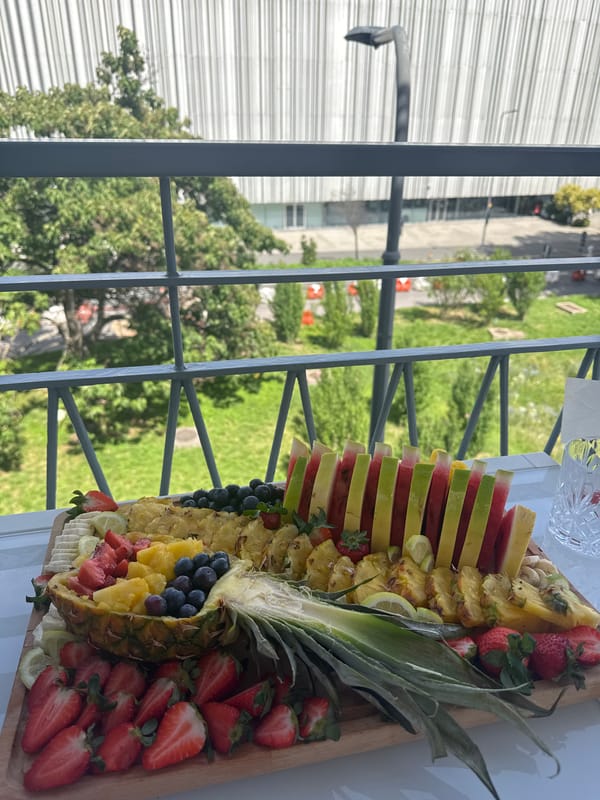 Fresh fruit platter arranged on wooden board in Milan