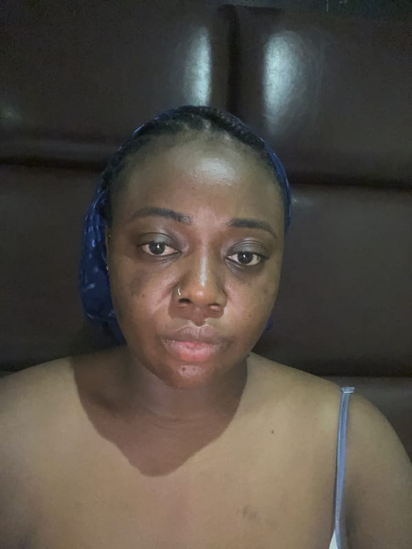 Woman captures selfie session in Abuja home setting