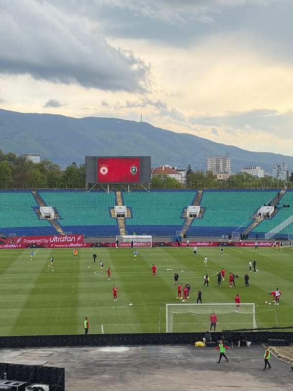 Football match draws crowds to Sofia stadium during golden hour