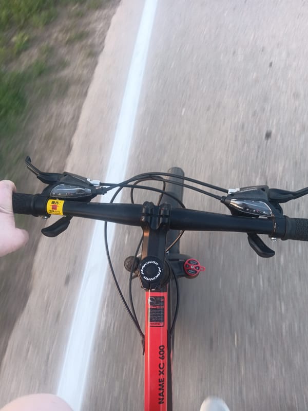 Cyclist rides through Foki countryside during sunset