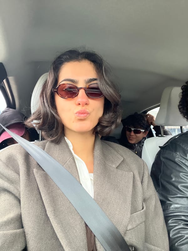 Woman photographed in vehicle wearing blazer and sunglasses in Ibiza