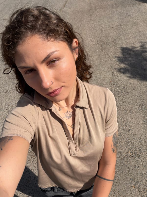 Woman lies on asphalt surface in Kiryat Bialik