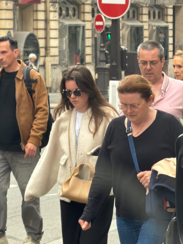 Ordinary street life documented across Paris neighborhoods Friday afternoon