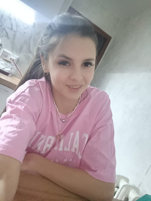 Woman takes selfies while enjoying casual indoor moment