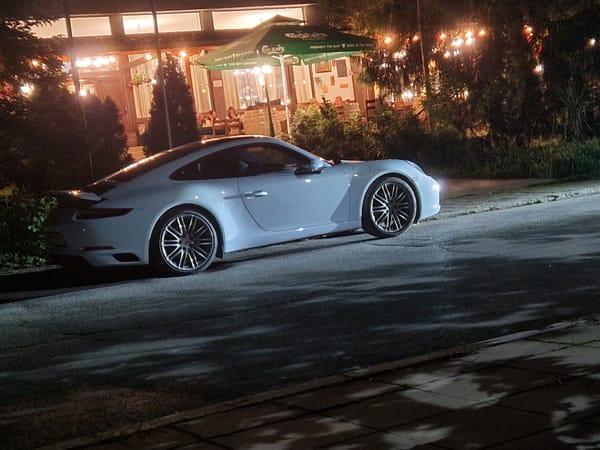 Man hangs upside down near parked Porsche in Razgrad