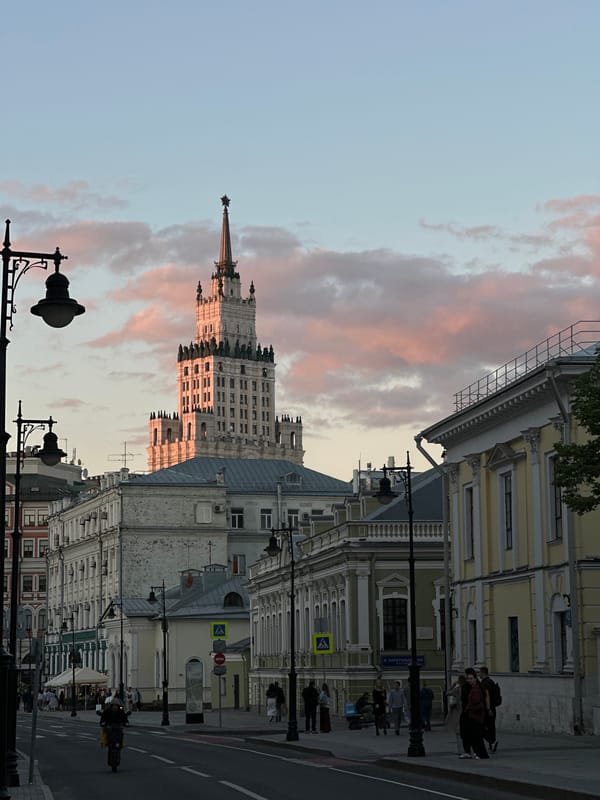 Moscow street scene shows Stalinist architecture, pedestrian activity