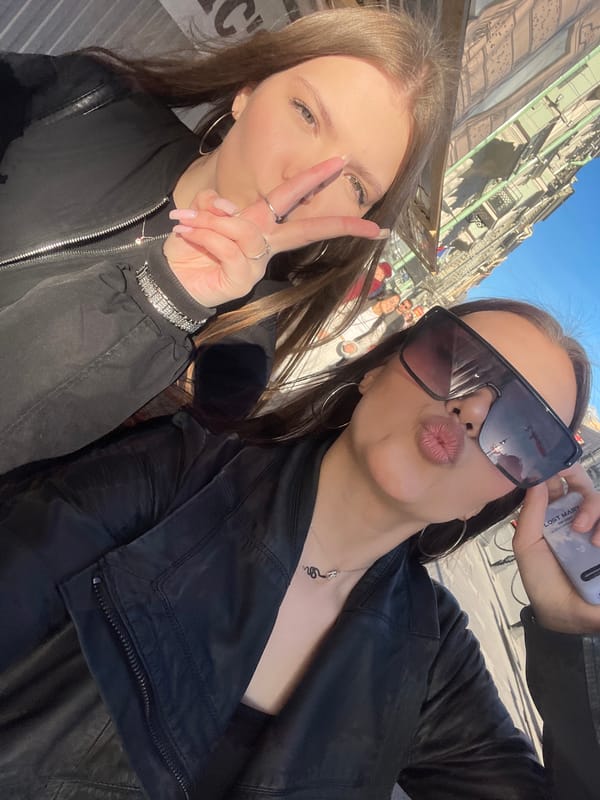 Young women photograph sunny afternoon outing in Saint Petersburg