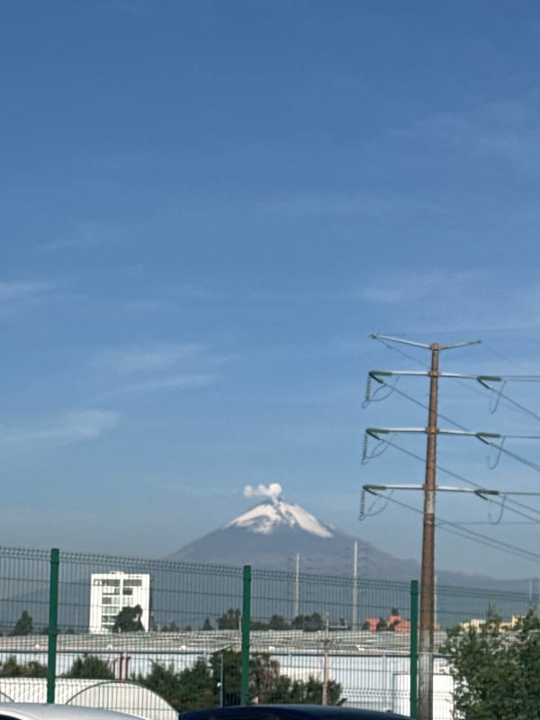 Mountain landscape documented in Sanctorum, Mexico with transmission tower