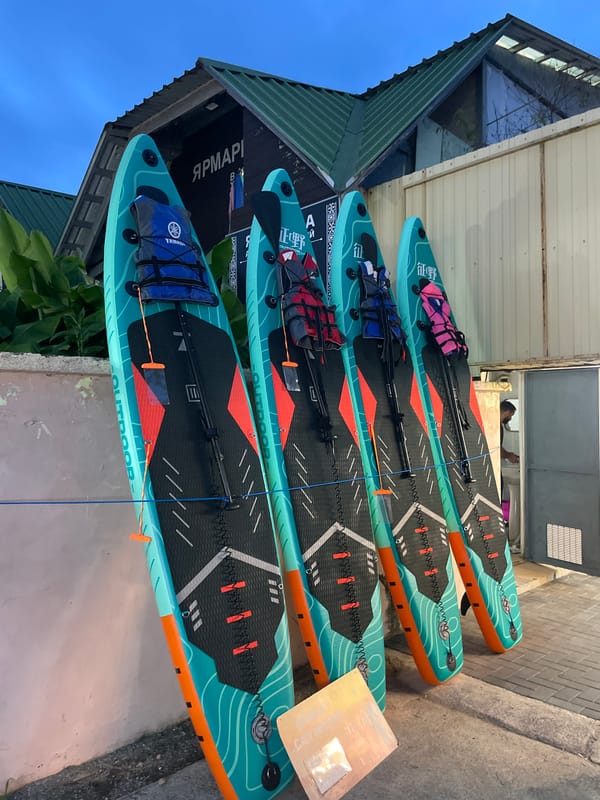 Summer water gear on display at a Khostinskiy outdoor vendor