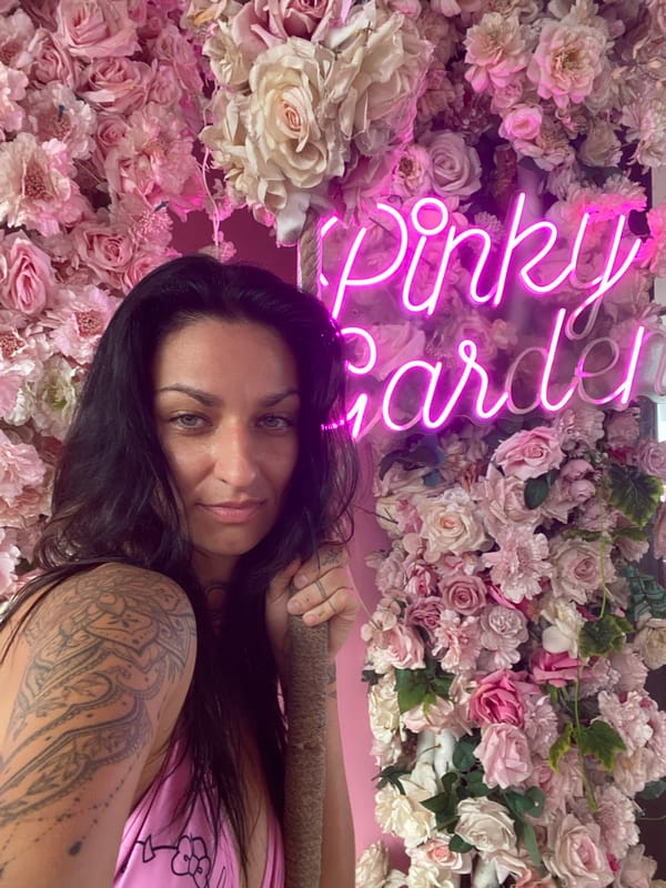Woman photographs at pink-themed venue in Vietnam