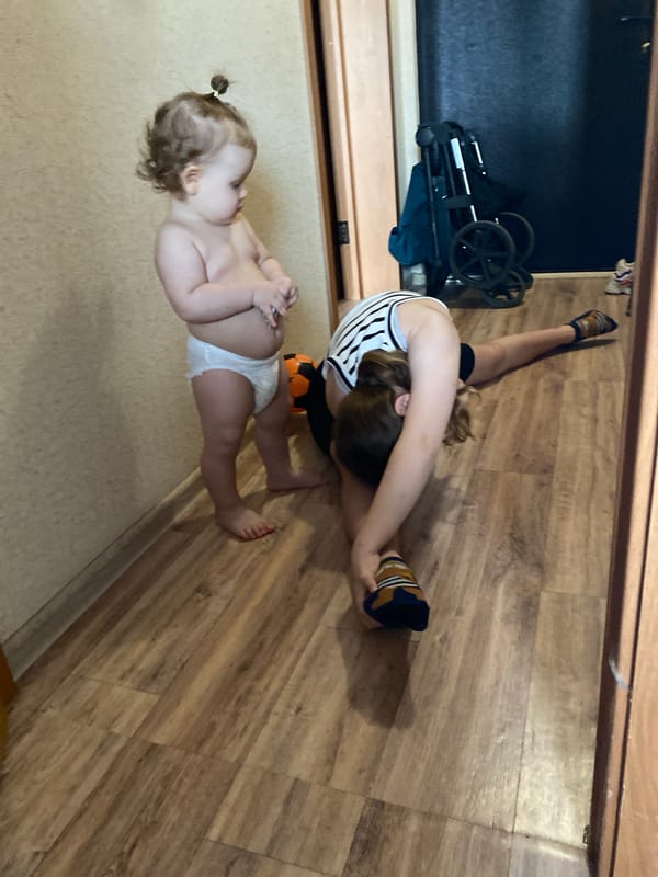 Adult and infant captured in playful indoor moments
