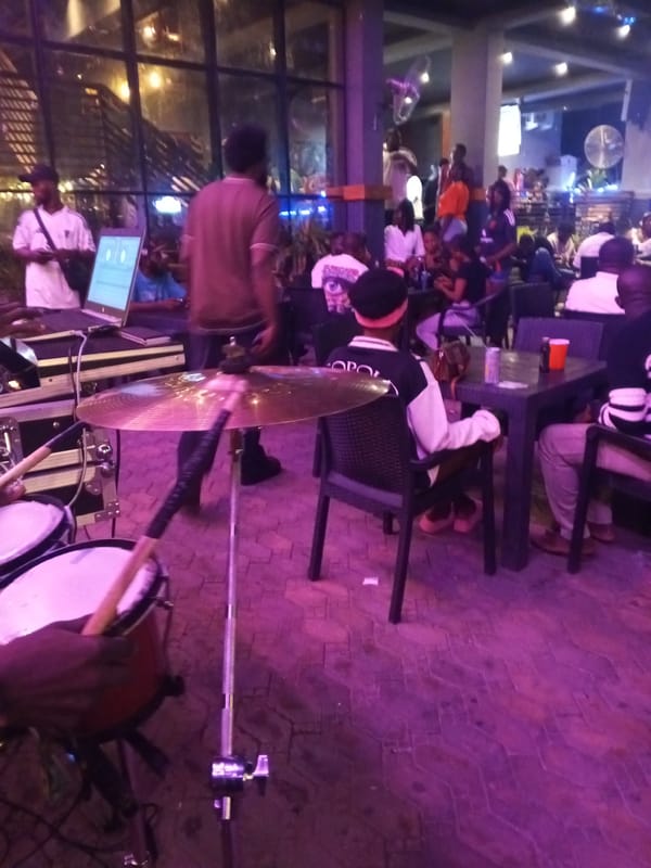 Evening social gathering at illuminated Lokoja bar draws crowds