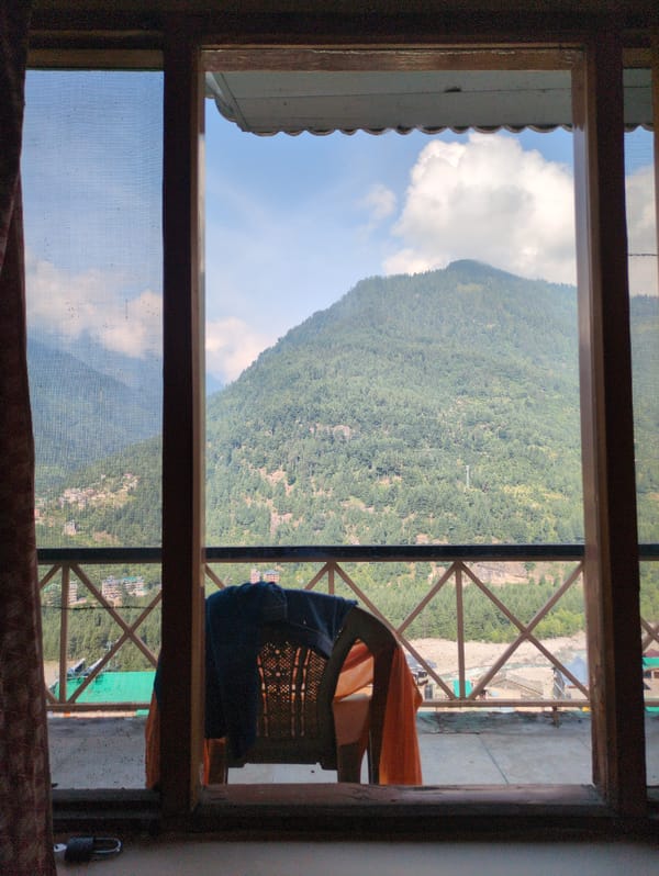 Vashisht village tucked into a Himalayan valley on a clear day