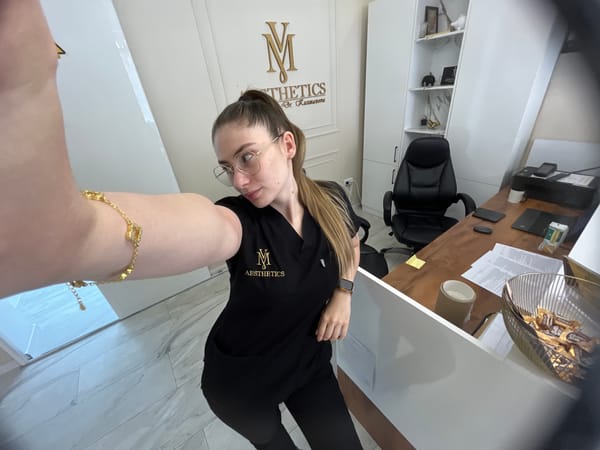 Healthcare worker takes selfies during break at medical facility