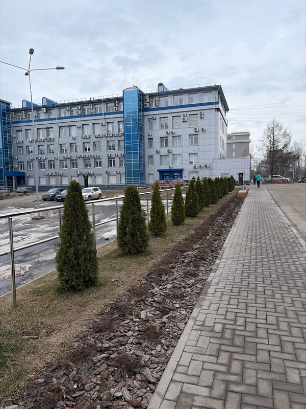 Early morning photo session near modern building in Izhevsk